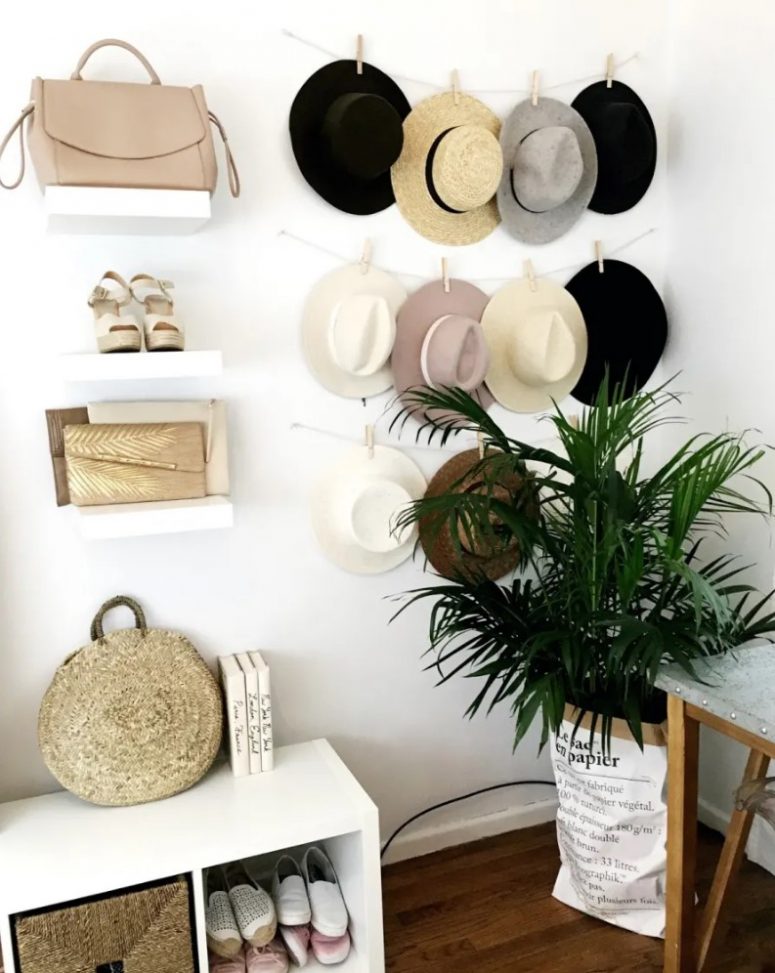 a simple and pretty hat hanger - some strings with clothespins will hold your hats and display them at their best