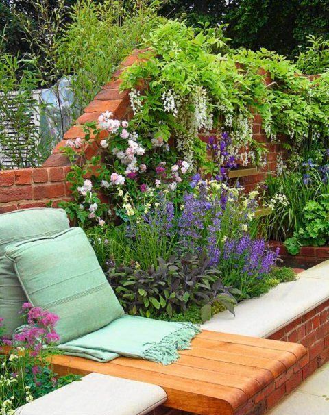 raised brick garden beds along the fence match it and match the space, and a built in lounger with pillows is a great idea to relax on raised brick garden beds along the fence match it and match the space, and a built-in lounger with pillows is a great idea to relax on
