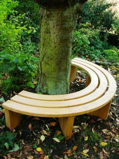 a very simple modern curved bench around the tree will let you have some rest in the shade and will match your modern garden style