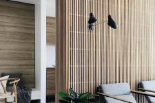 31 a mid-century modern interiors with plenty of stained wood incorporated – a wood slat accent wall and wood clad walls in other spaces