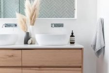 a cute boho bathroom design with a wooden vanity