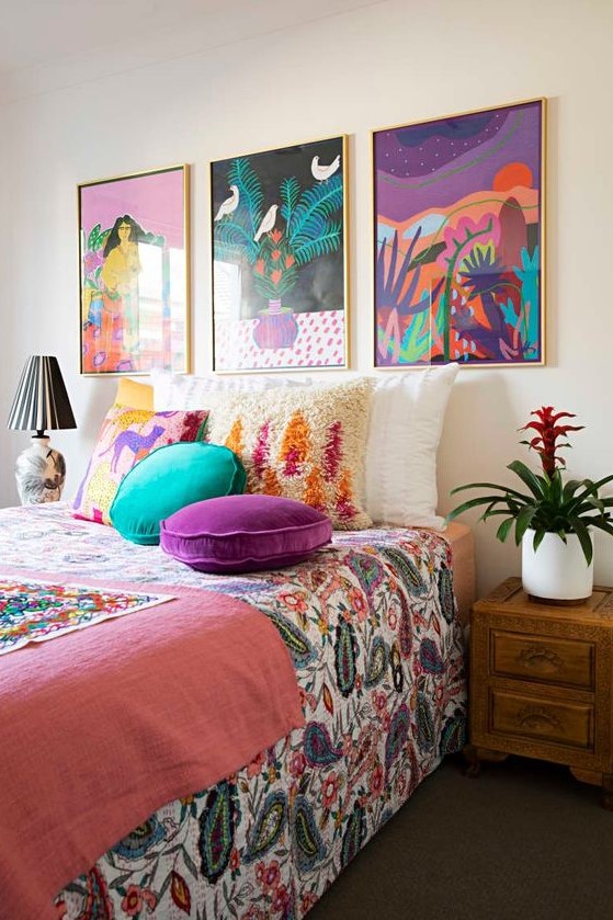 a colorful gallery wall for a bedroom