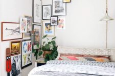 a small bedroom infused with color with printed textiles and a bolc gallery wall that goes to the corner and next wall
