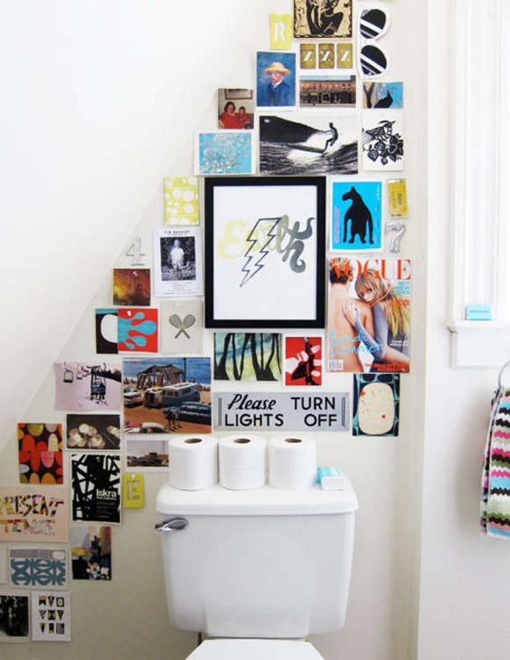 a white attic mudroom with a super colorful poster and magazine cover gallery wall for a touch of fun and brightness in the space