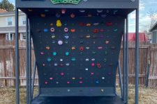 27 a cool and smartly organized climbing wall with a roof and a soft pad under the wall to make sure your kids won’t hurt themselves