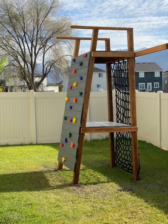 a kids' climbing wall and climbing netted rop is a cool idea for super active children, it can be installed anywhere