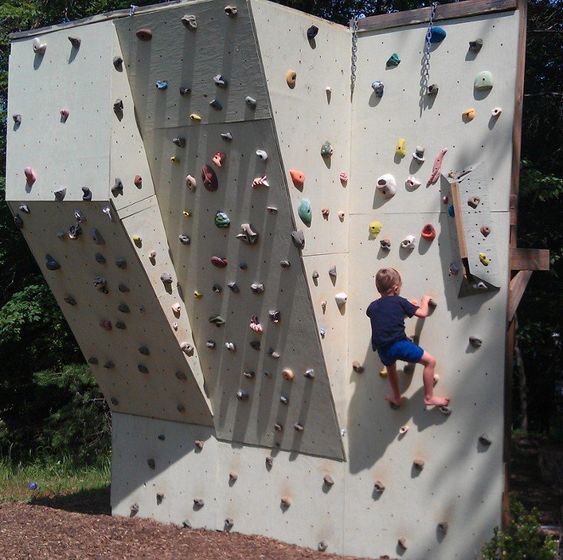 a large backyard climbing wall for kids is a great idea to make your outdoors ultimate and inspire kids to do sport