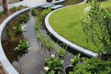 37 an ultra-modern curved water garden of greenery and white blooms is an amazing idea for a modern garden