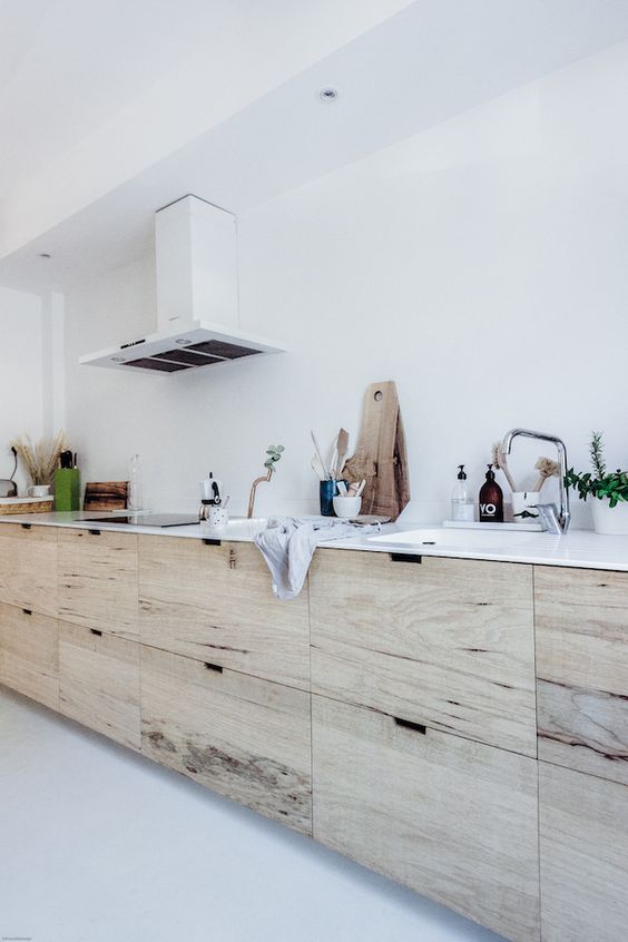 https://www.digsdigs.com/photos/2022/07/a-Nordic-neutral-kitchen-with-no-hardware-cabinets-a-white-stone-countertop-a-white-hood-and-neutral-fixtures.jpg