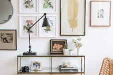 a chic gallery wall with thin frames and botanical theme as the main one feels very spring-like