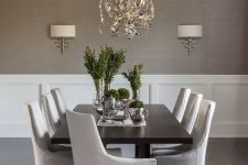 a dining space with grasscloth wallpaper