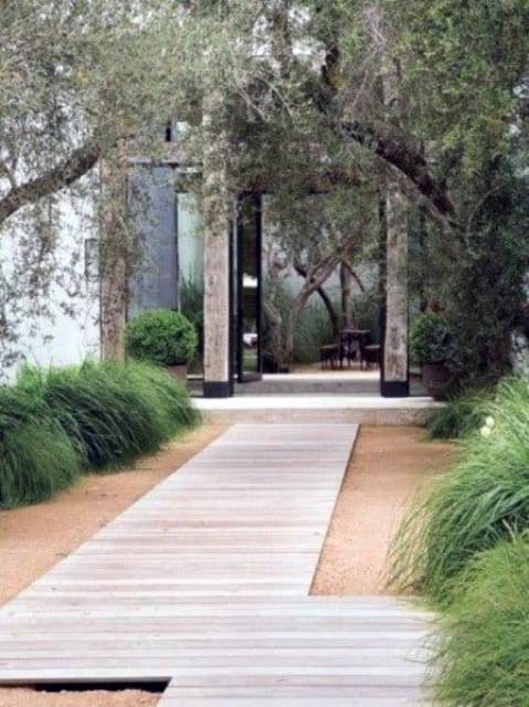 a lovely modern front yard design a contemporary whitewashed wooden planked walkway is a great idea for a modern, contemporary or minimalist outdoor space
