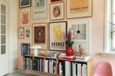 a cool pop art gallery wall with thin frames and various kinds of prints and artworks in bright colors is very catchy