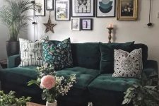 a creative boho gallery wall with mismatching art in various frames accented with additional lights is super cool