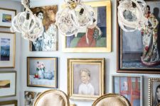 a jaw-dropping dining room with a simple table and vintage chairs, whimsical rope pendant lamps and artworks all over the space
