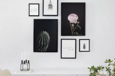 a modern free form gallery wall with mismatching frames and no frame art, with beautiful artsy posters