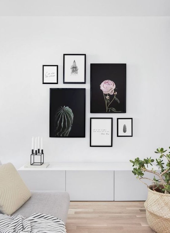 a modern free form gallery wall with mismatching frames and no frame art, with beautiful artsy posters