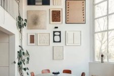 a pretty abstract gallery wall in neutrals, white and black, with various textures is a stylish idea to try