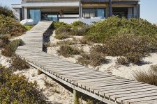 a raised whitewashed wooden walkway is a perfect idea for a beach outdoor space, whitewashed wood is a great match