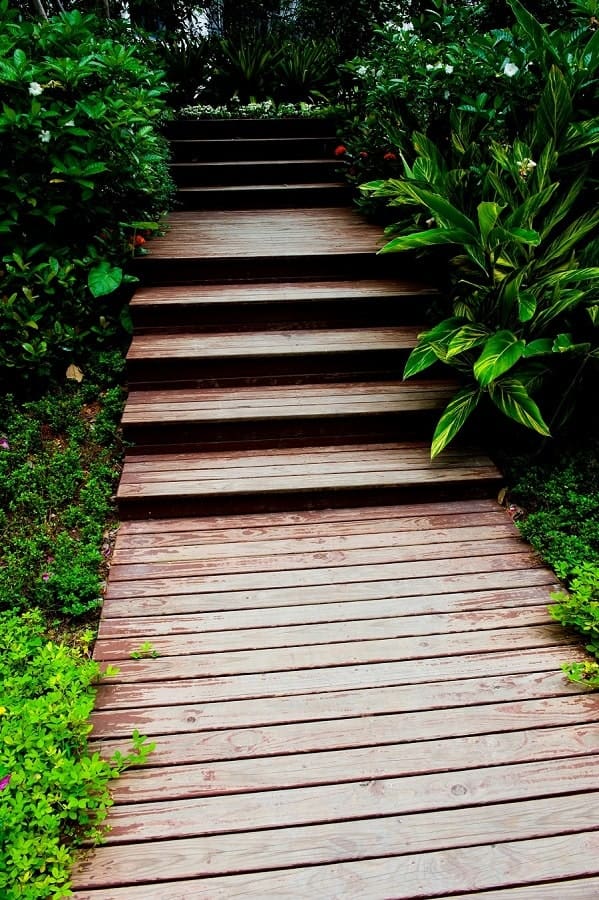 a simple stained planked wooden walkway with steps is a classic idea for any garden, from a modern to a zen like one a simple stained planked wooden walkway with steps is a classic idea for any garden, from a modern to a zen-like one
