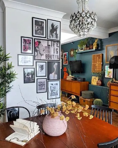 a smal gallery wall with pop art and matching black frames is a cool way to accessorize the space and make it cool