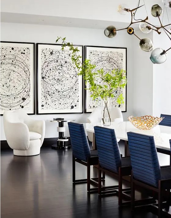 a statement gallery wall with black frames, matching pictures and small white matting is a bold solution for decor