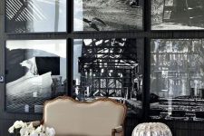 a statement gallery wall with thin black frames that seem invisible due to using black and white art and no matting