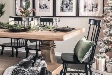 a stylish gallery wall with black frames, white matting and black and white family pictures for a traditional feel