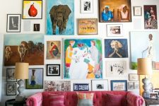 a super bright gallery wall with bold artworks with frames and without them, in bold colors and with a free form for a creative touch