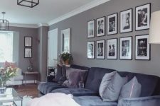 a symmetrical gallery wall with matching black frames and black and white pictures is always a good idea for an elegant touch