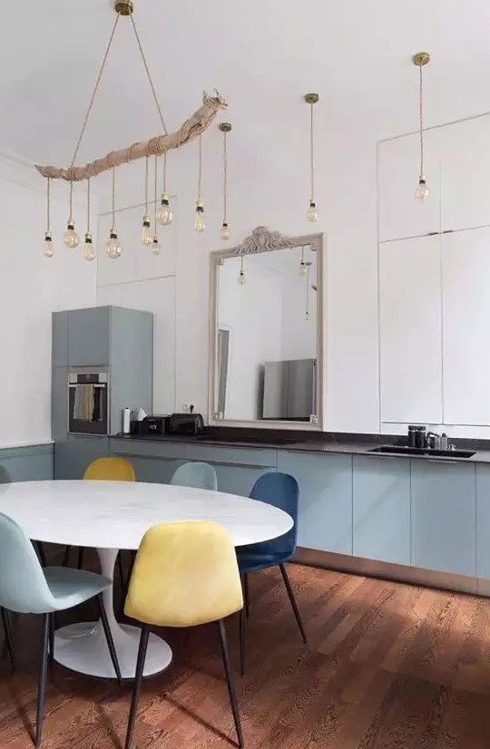 pendant bulbs and a drftwood chandelier with matching bulbs plus blue cabinetry for an absolutely innovative coastal kitchen look