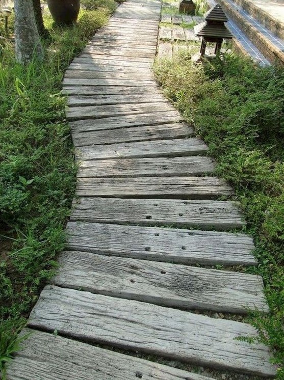 rustic whitewashed wooden plank path contrasts the greenery and brings a rustic and vintage feel to the space rustic whitewashed wooden plank path contrasts the greenery and brings a rustic and vintage feel to the space