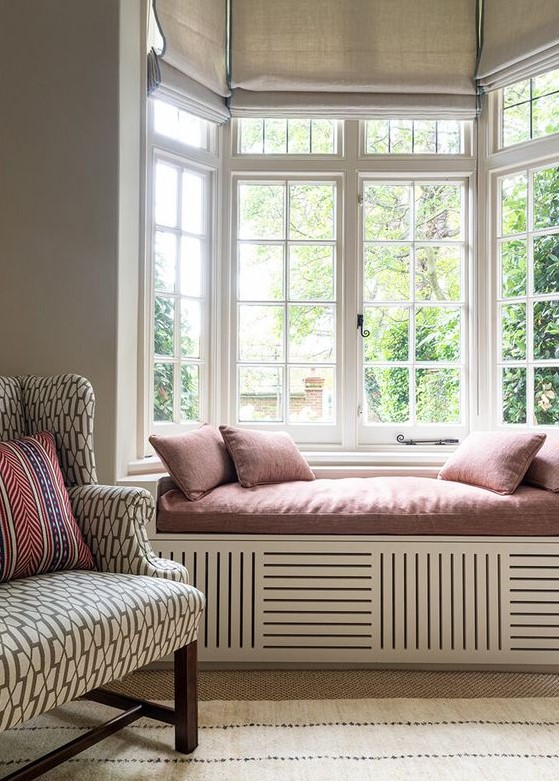 a French bow window with a clerestory part and burlap blinds on each part is a lovely idea for a refined space