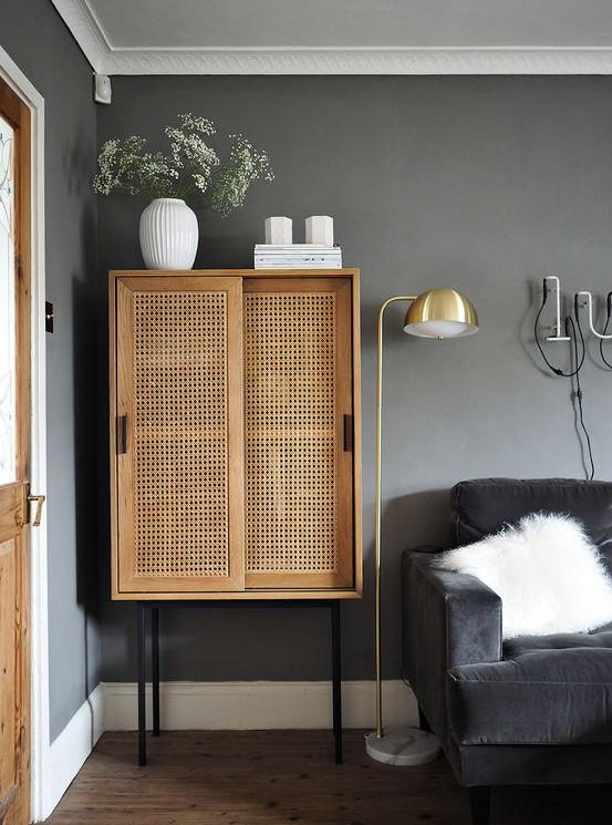 a beautiful rattan cabinet with sliding doors can be used as a home bar or a storage unit and is a great solution for any space