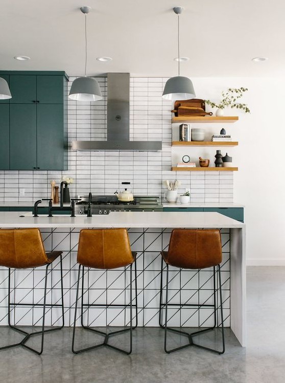 a blue kitchen with a white stacked subway tile backsplash and white stone countertops is a very chic and bold idea