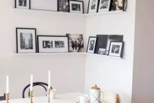 a simple corner black and white gallery wall
