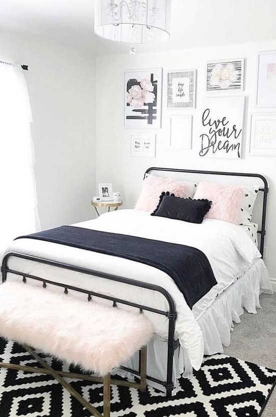 a lovely teen bedroom with a black metal bed, contrasting bedding, a pretty gallery wall and a pink faux fur bench