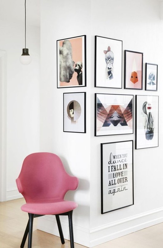 a truly interesting gallery wall with thin black frames and colorful modern prints is a catchy idea to go for