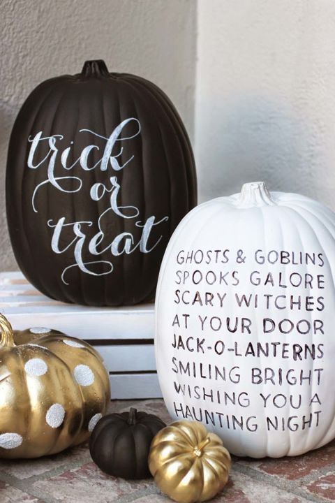 a black and a white pumpkin decorated with a black and white sharpie - with some words - look nice and quite modern at the same time