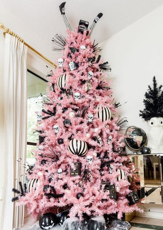 a creepy cute Halloween tree with black and white ornaments, striped ones, jack-o-lanterns and twigs