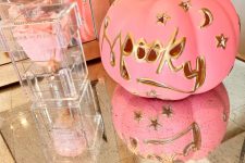08 a carved pink pumpkin with gold detailing, moons and stars is a fantastic idea for Halloween