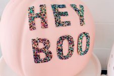 10 a pink Halloween pumpkin decorated with colorful sequin letters is a lovely and fun idea for the party
