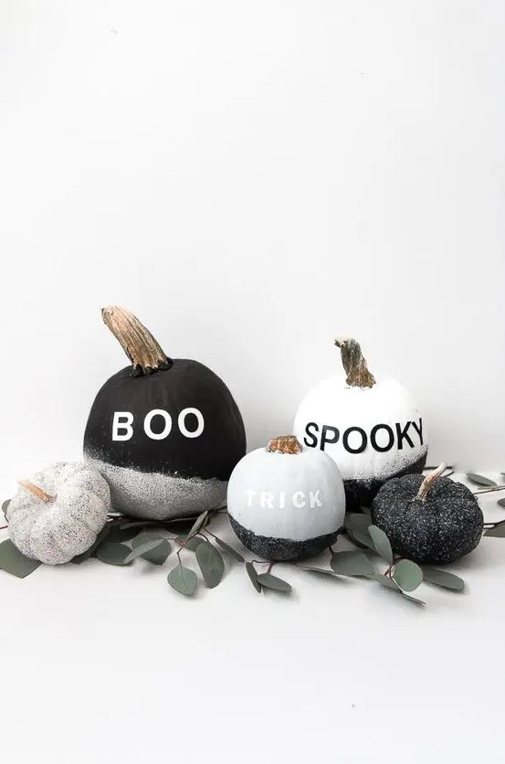make a display of cool black and white glitter pumpkins with vinyl letters - they are very easy to DIY