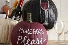 21 a matte burgundy pumpkin, a glossy black one with letters and a wine glass crafted on the pumpkin are amazing for Halloween