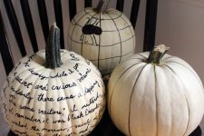 26 white pumpkins decorated with a black sharpie, with quotes, a spider and just stripes, will be a great last minute craft