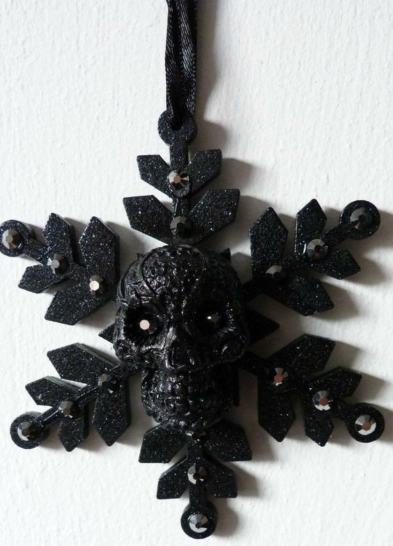 a cool dark Halloween ornament - a black snowflake with a skull, with rhinestones is amazing for styling a tree