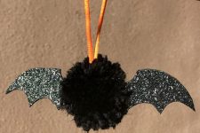 30 a fun and cute black bat Halloween ornament of a black pompom and black glitter wings is adorable for Halloween