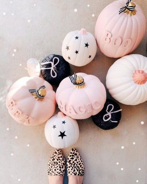 beautiful modern pumpkins in blush, white, black, with stars, letters, yarn and other decor are perfect for chic modern decor