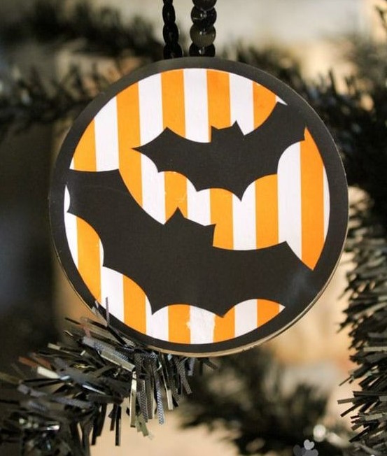 a round Halloween ornament in orange, black and white, with bats and beads is a lovely idea for a Halloween tree