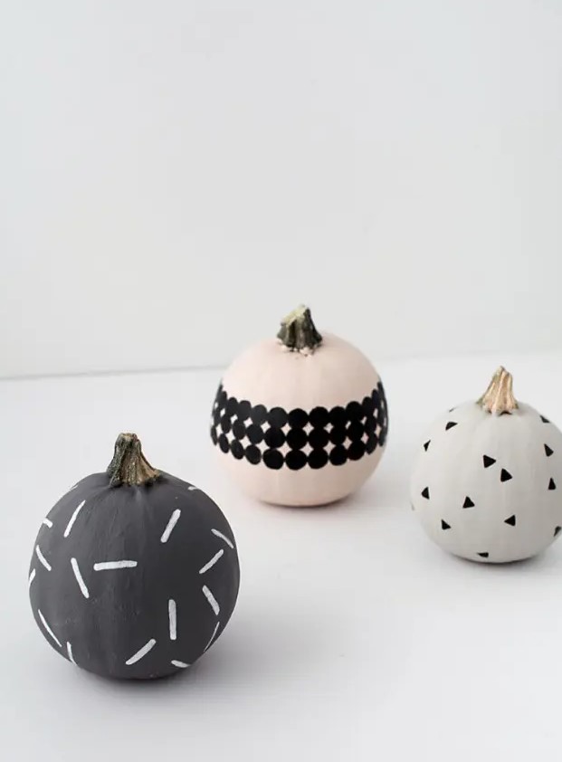 modern patterned pumpkins made using sharpies, paint and stickers look nice and cool and will be a great idea for modern Halloween